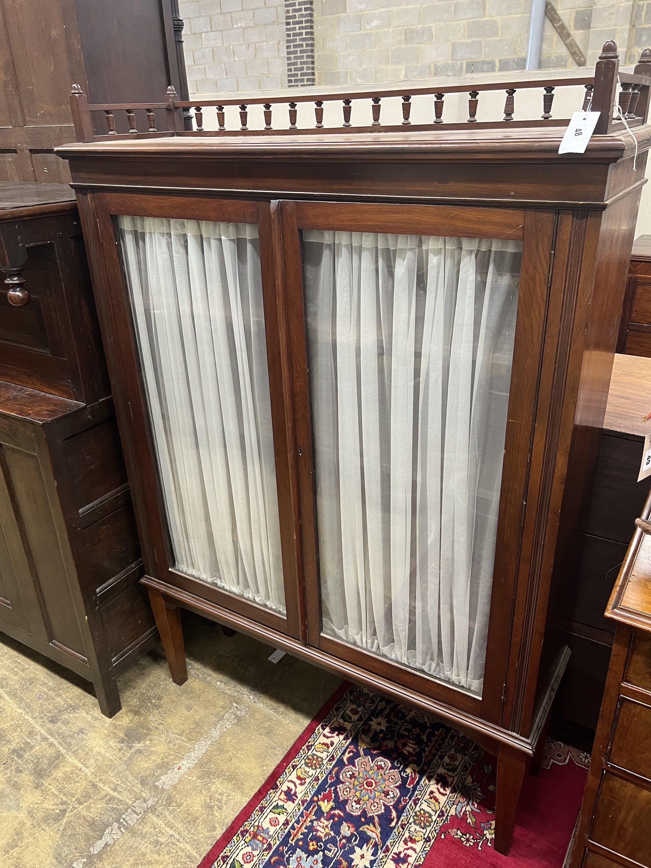 A 19th century Continental mahogany display cabinet, width 116cm, depth 35cm, height 171cm